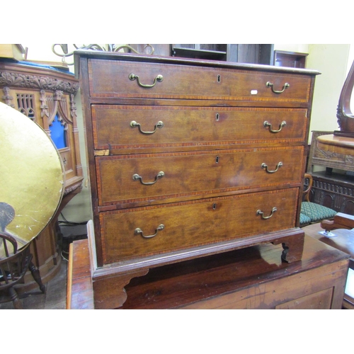 2428 - A small inlaid Edwardian mahogany chest of four long graduated drawers crossbanded in satinwood rais... 