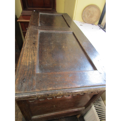 2435 - Early 18th century oak coffer with panelled framework, the front elevation with repeating geometric ... 