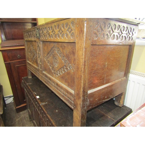 2435 - Early 18th century oak coffer with panelled framework, the front elevation with repeating geometric ... 