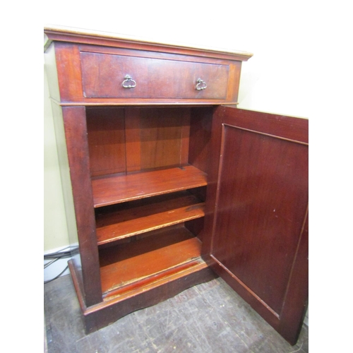 2438 - A mid 19th century mahogany side cupboard enclosed by a panelled door and a single frieze drawer, 11... 