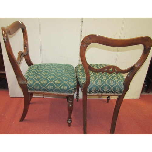 2439 - A set of four Victorian rosewood with shaped and pierced splats, upholstered seats on turned support... 