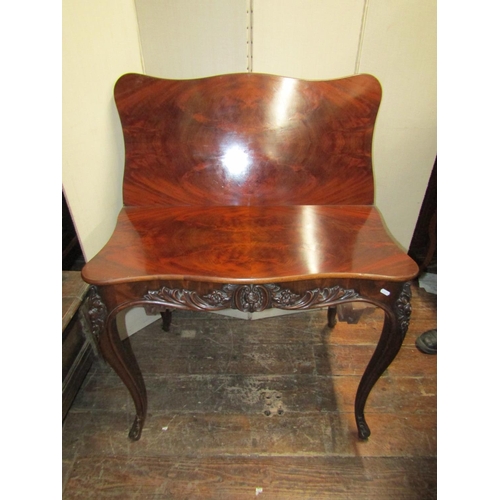 2440 - A good quality 19th century mahogany fold over top tea table of serpentine form with well matched fl... 