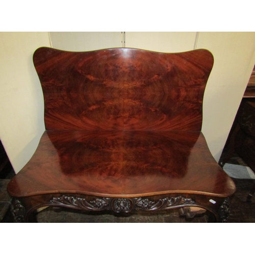 2440 - A good quality 19th century mahogany fold over top tea table of serpentine form with well matched fl... 