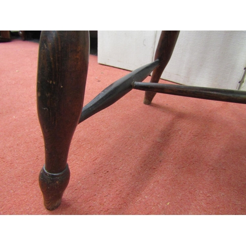 2442 - A Georgian Windsor ashwood stickback elbow chair on turned supports