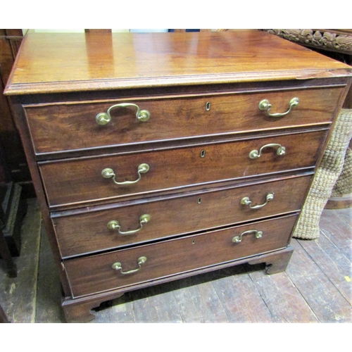 2447 - Georgian mahogany chest of four long graduated drawers with brass swan necked handles on bracket sup... 