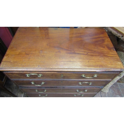 2447 - Georgian mahogany chest of four long graduated drawers with brass swan necked handles on bracket sup... 