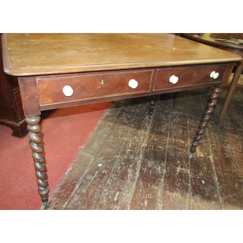 2448 - Mid 19th century mahogany writing table raised on four barley twist supports enclosing two frieze dr... 