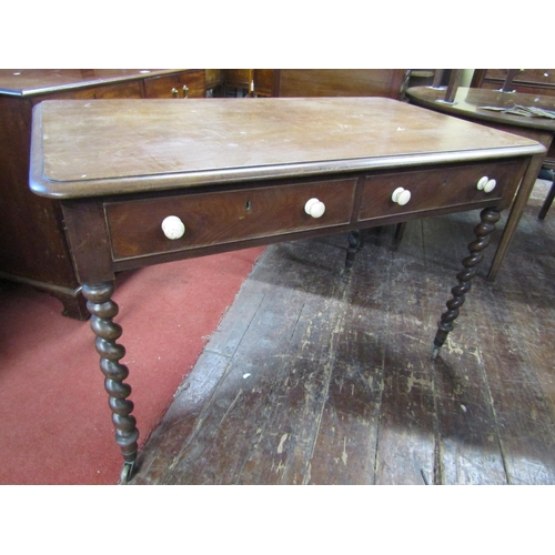 2448 - Mid 19th century mahogany writing table raised on four barley twist supports enclosing two frieze dr... 