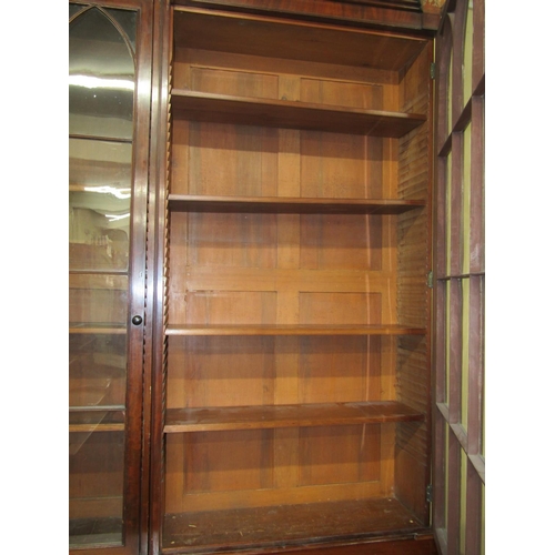 2450 - A good quality Georgian mahogany library bookcase of full height, the lower section enclosed by two ... 