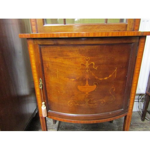 2452 - A well matched pair of inlaid Edwardian mahogany display cabinets each enclosed by a single glazed p... 