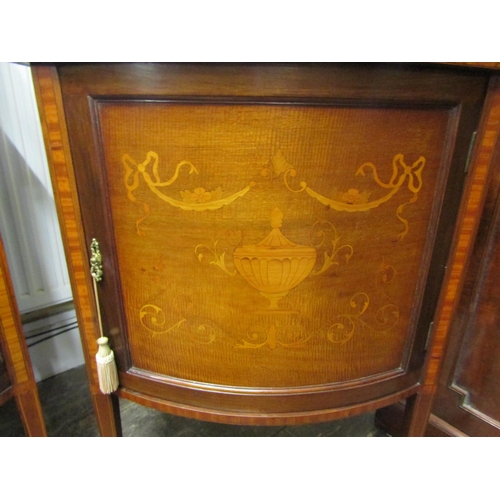 2452 - A well matched pair of inlaid Edwardian mahogany display cabinets each enclosed by a single glazed p... 