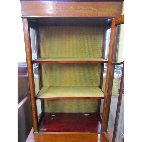 2452 - A well matched pair of inlaid Edwardian mahogany display cabinets each enclosed by a single glazed p... 