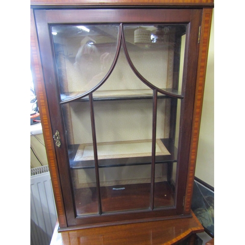 2452 - A well matched pair of inlaid Edwardian mahogany display cabinets each enclosed by a single glazed p... 