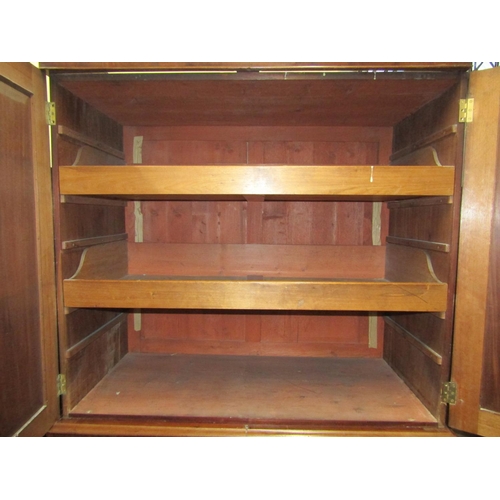 2454 - A Regency mahogany linen press, the lower section enclosed by three long drawers, the upper section ... 