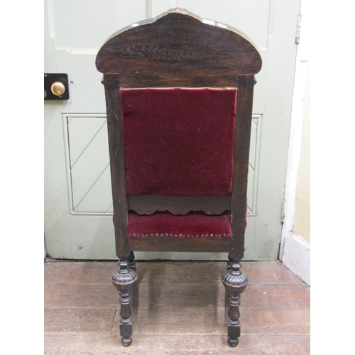 2456 - Mid Victorian oak side chair, the framework with heavily carved detail, facial mask, geometric repea... 