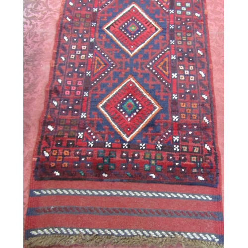 2461 - A Meshwani runner with a central diamond patterned panel. 250cm x 59cm.