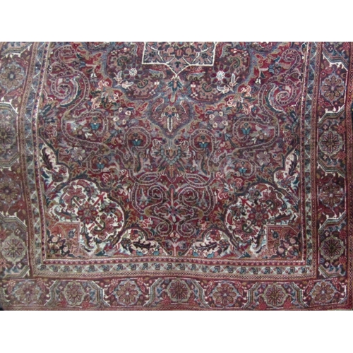 2464 - A middle eastern design carpet with an all over scrolling floral pattern, 300cm x 190cm