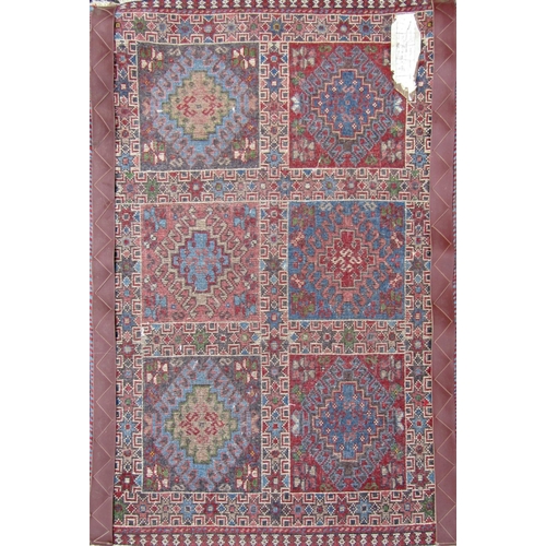 2469 - A small Iranian Yalameh rug with a panelled design. 90cm x 60 cm approx