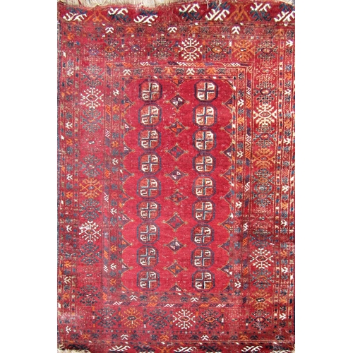 2470 - An early 20th century Turkoman rug with two rows of small elephant foot gul on a red ground.170cm x ... 