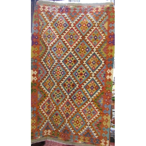 2473 - A Chobi kilim carpet, with a multi coloured diamond pattern. 198cm x 123cm.