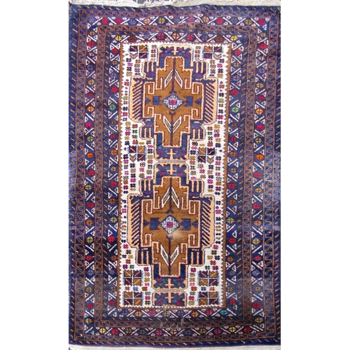 2476 - A Kazak style rug with an interlocking central lozenge shaped medallion. 145cm x 80cm