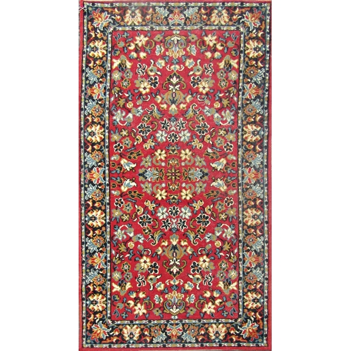 2491 - A modern Middle Eastern design carpet with an all over floral pattern. 163cm x82cm approx and anothe... 