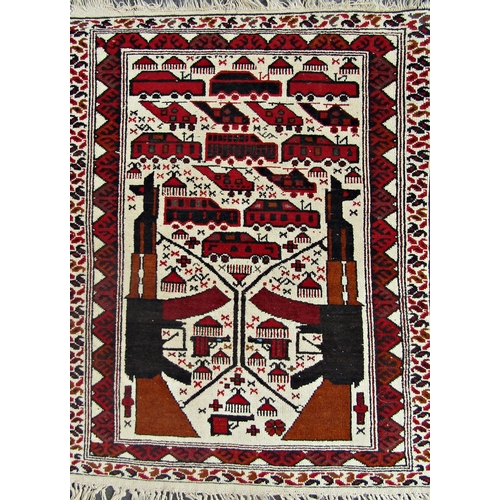 2493 - A late 20th century Afghan War Carpet featuring two AK 47 rifles, pistols and helicopters. 120cm x 8... 