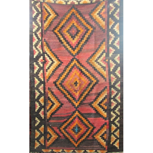 2504 - A Lori runner with diamond geometric pattern in orange and pink hues. 210cm x 210cm approx