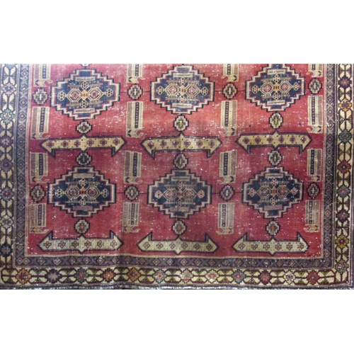 2518 - A Lori design carpet with the six stepped medallions to the central panel, 275cm x 200cm