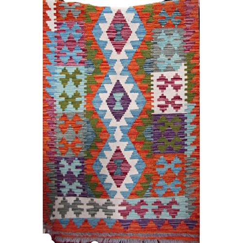 2522 - A Khobi Kelim runner with brightly coloured geometric pattern, 250cm x 81cm