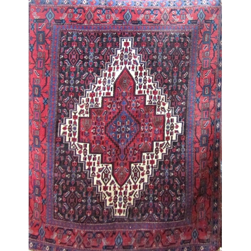 2523 - A Senneh rug with stepped lozenge shaped central panel decorated with stylised flowers, 145cm x 125c... 