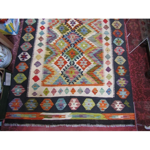 2531 - A Choi kilim with a brightly coloured central geometric panel. 157cm x 105cm.