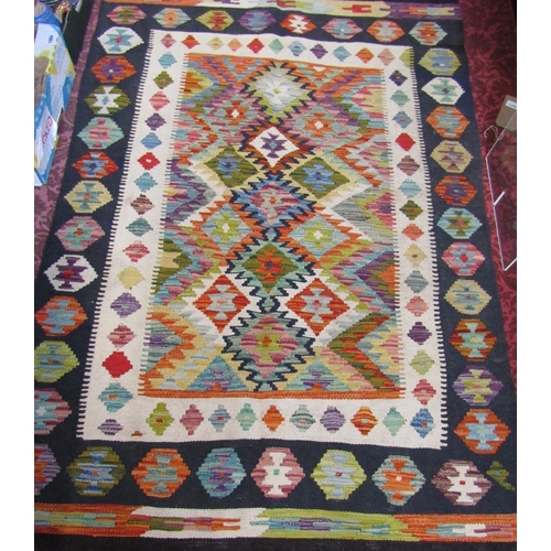 2531 - A Choi kilim with a brightly coloured central geometric panel. 157cm x 105cm.