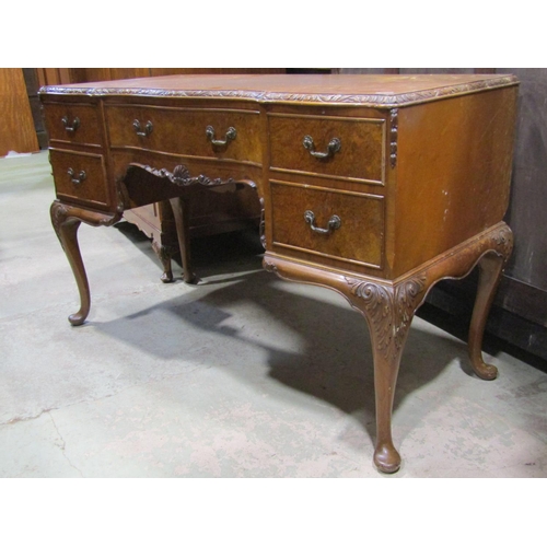 2183 - A walnut and figured walnut bedroom suite comprising double bedstead, bedside cabinet and two double... 