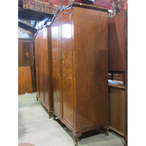 2183 - A walnut and figured walnut bedroom suite comprising double bedstead, bedside cabinet and two double... 