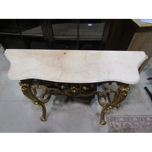 2166 - A reproduction console/pier table raised on four shaped and scrolled gilt supports, with acanthus an... 