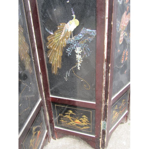 2129a - A low Japanese lacquered freestanding four fold screen, the arched panels with decorative exotic bir... 