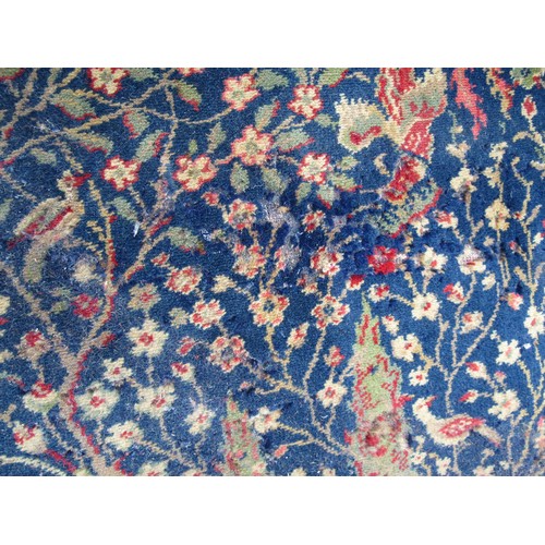 2460 - A large country house size carpet with 3 central medallions on a blue busy floral and bird pattern g... 