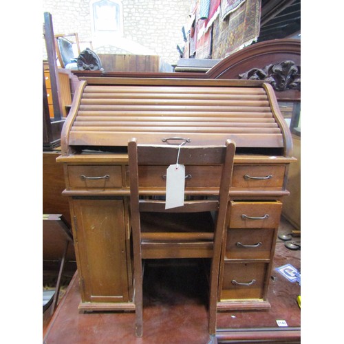 2139 - A child's stained pine and beechwood kneehole twin pedestal roll top desk with simply fitted interio... 