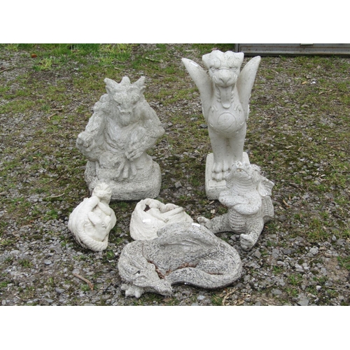 2005 - A composition stone garden ornament in the form of a mythical winged lion raised on a rectangular pl... 