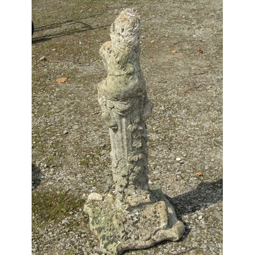 2010 - A weathered cast composition stone garden ornament in the form of a girl kneeling on a fluted column... 