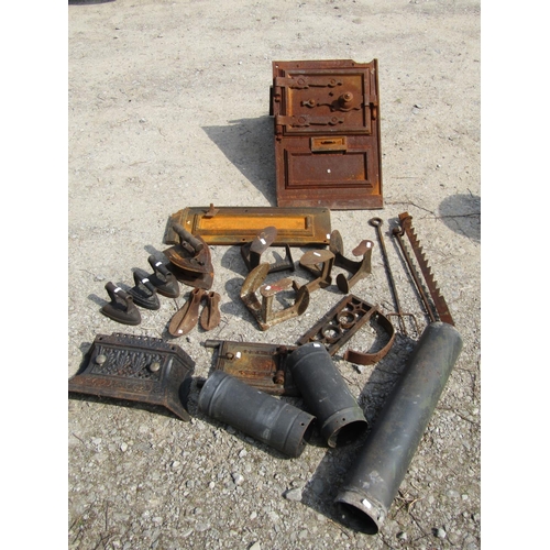 2011 - The remains of an antique cast iron range, further fire related items, cast iron flat irons, various... 