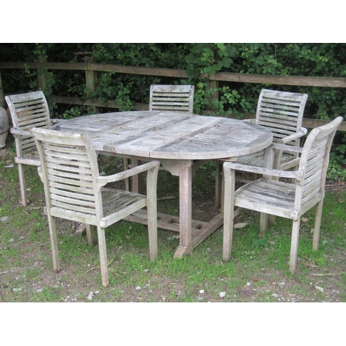 2018 - Weathered teak D-end extending garden table with slatted panelled top and two bi-folding leaves, rai... 