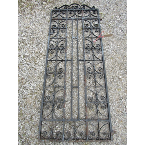 2024 - A heavy gauge painted iron pedestrian side gate with repeating open scroll work panels, 80 cm wide x... 