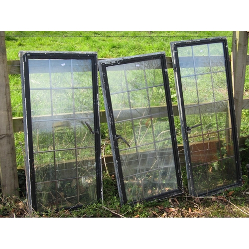 2034 - Four reclaimed heavy gauge galvanised steel framed windows with leaded light panels, the largest 100... 