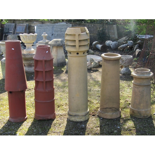 2038 - Five reclaimed chimney pots of varying size and design including three buff coloured examples, the t... 