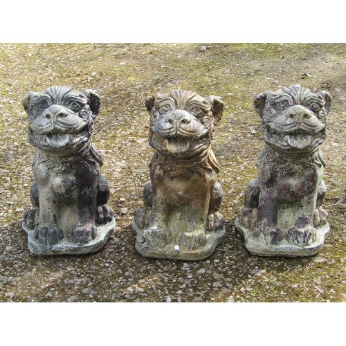 2044 - Three weathered cast composition stone garden ornaments in the form of dogs of fo, 50 cm high
