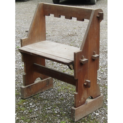 2049 - An ecclesiastical chair with wide seat within a pegged framed 82 cm wide