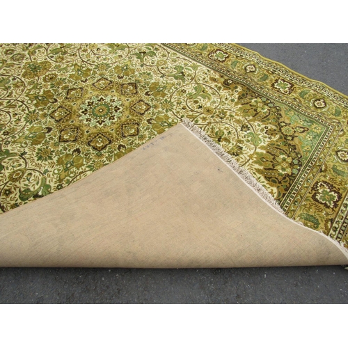 2777 - A large Belgian made Louis de Poortere Persian style  carpet with an all over floral pattern on a ye... 