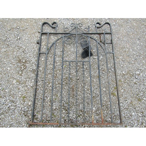 2001a - A small iron pedestrian gate with simple scroll and further detail 3ft wide approximately